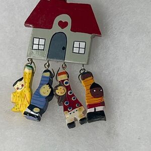 Artisan multicultural wooden school children brooch.